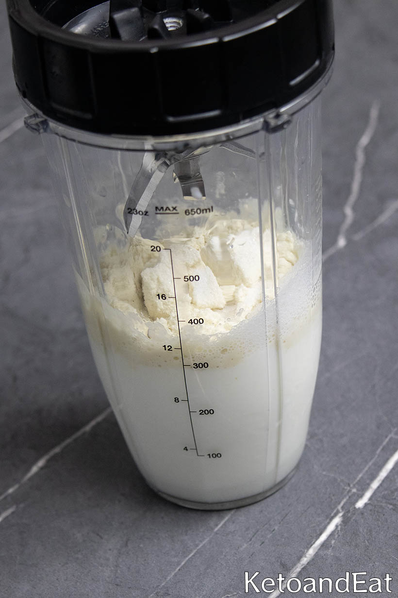 Blending protein powder and milk for milkshake